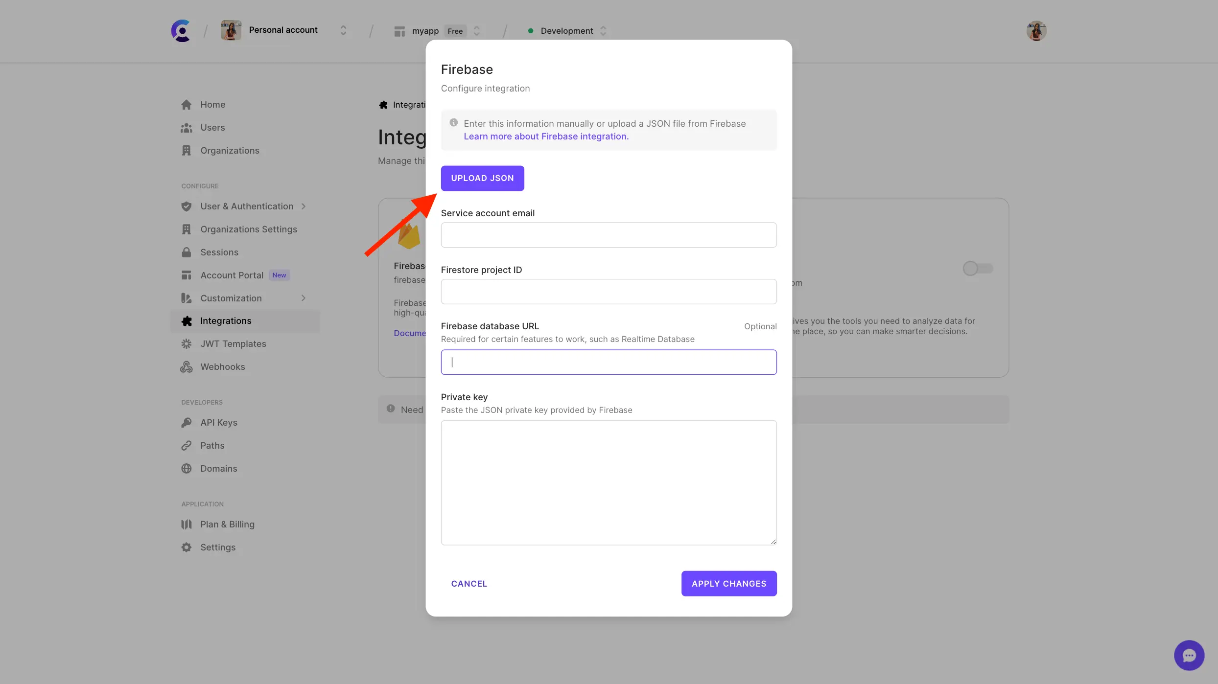 The Firebase configuration form in the Clerk Dashboard. A red arrow is pointing to the 'Upload JSON' button.